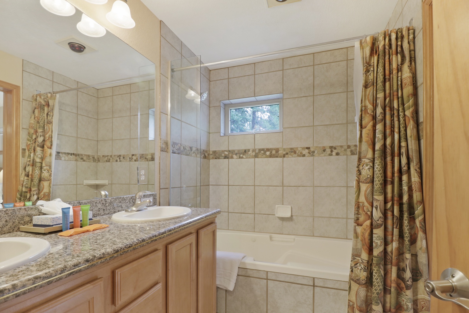 Step into your spacious bathroom with elegant tile work and a granite vanity. Soak in the tub after a day of exploring, or freshen up in the shower—it's your private retreat.