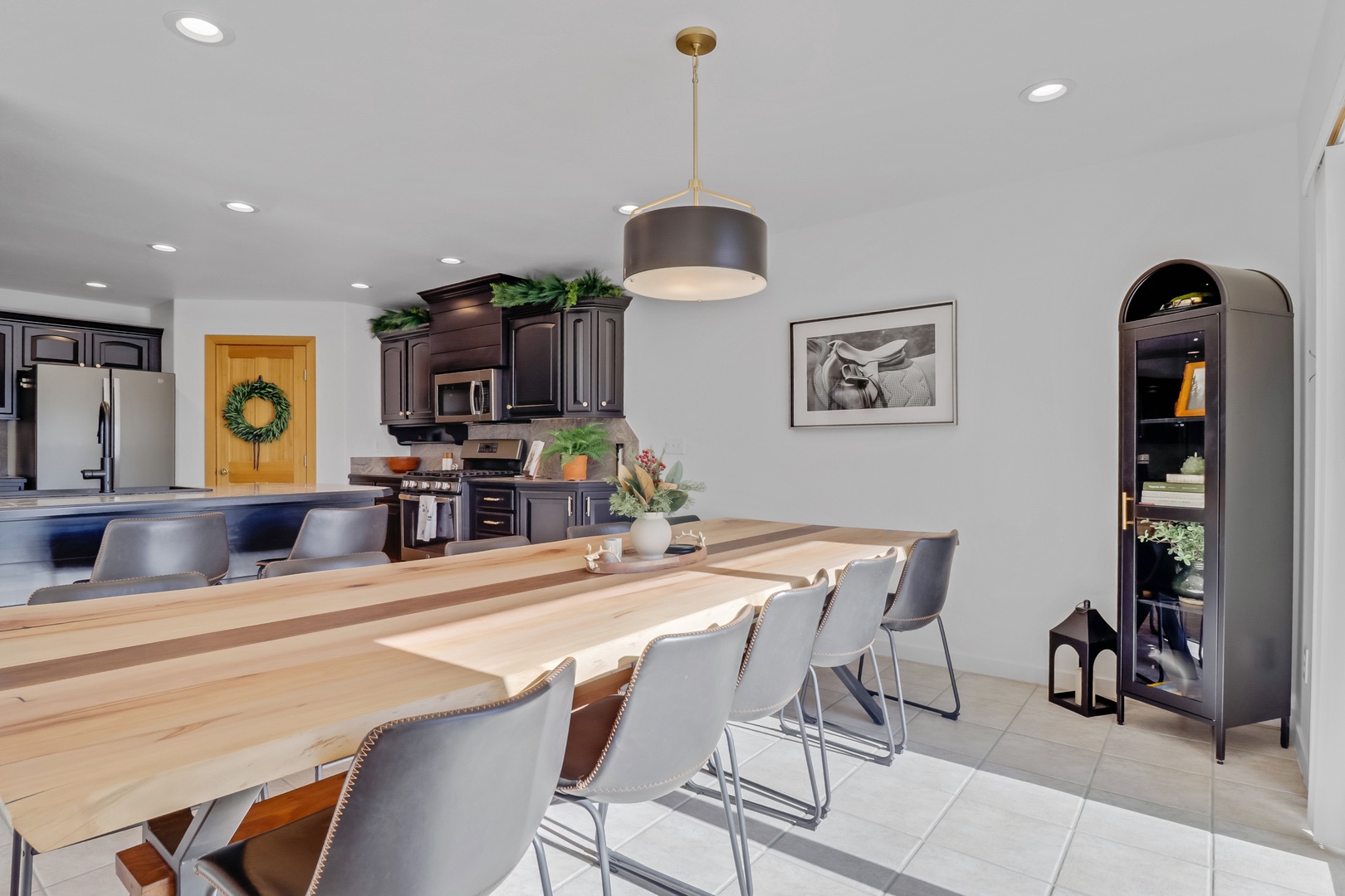 Your spacious open-concept dining area flows seamlessly into the modern kitchen, creating the perfect space for memorable meals together.