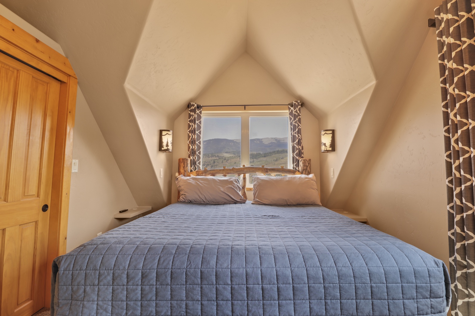 Wake up to breathtaking mountain panoramas from your cozy loft bedroom. Your morning coffee never looked so good framed by those peaks through the window.