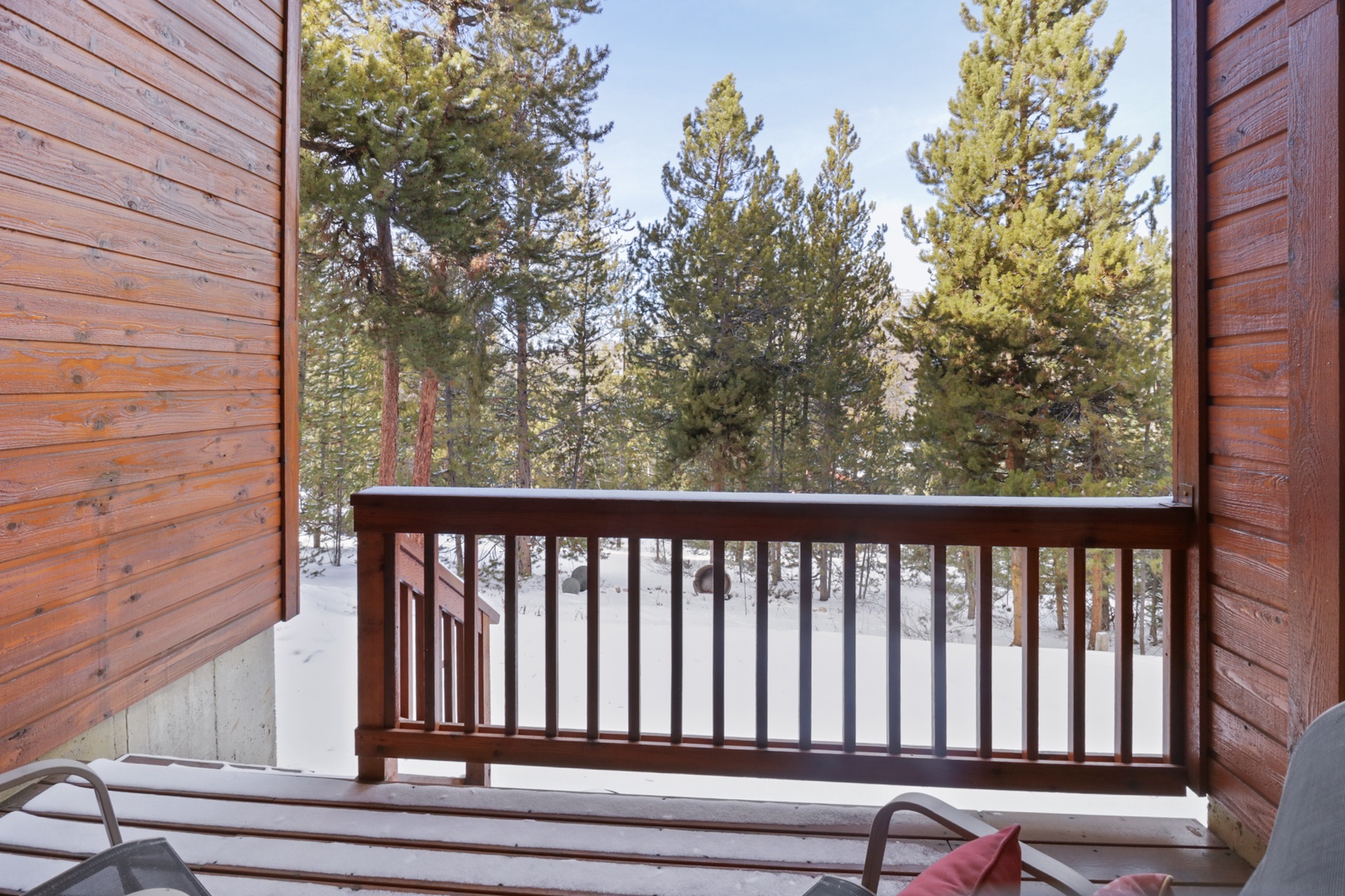 Step onto your private balcony and breathe in the crisp mountain air while gazing at snow-dusted pines.