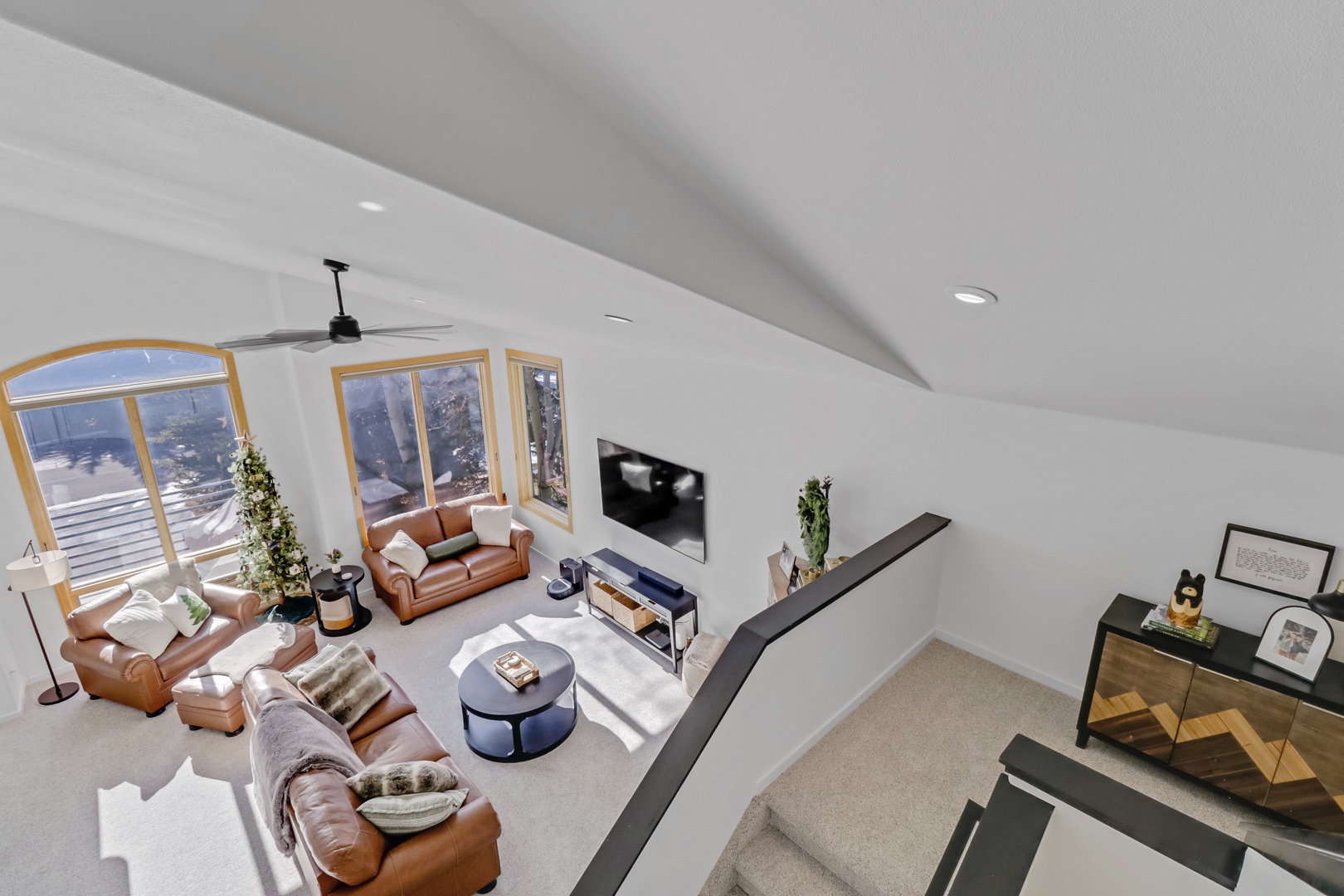 Relax in your bright, modern living space with leather seating, mountain views, and stylish furnishings that create the perfect retreat.