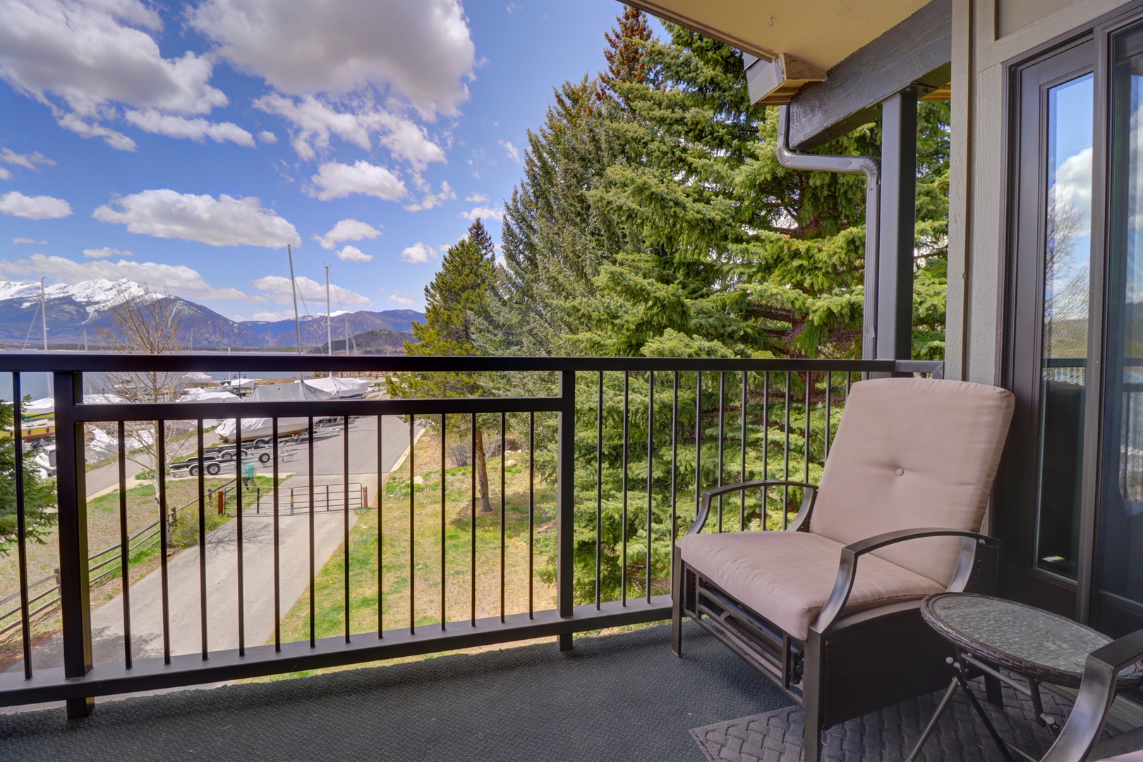 A private balcony with mountain and landscape views, offering a peaceful spot to relax and take in the surrounding natural beauty and snow-capped peaks.