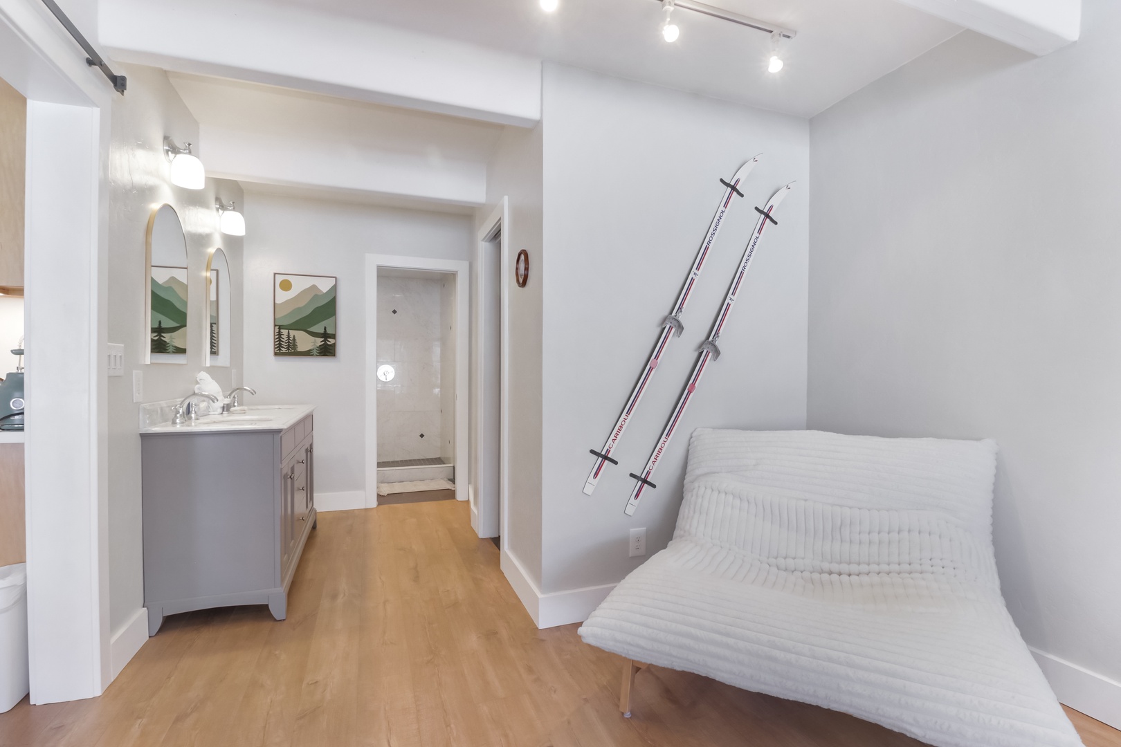 Relax in your stylish ski-themed bedroom with stunning mountain artwork, where adventure meets comfort after the slopes.