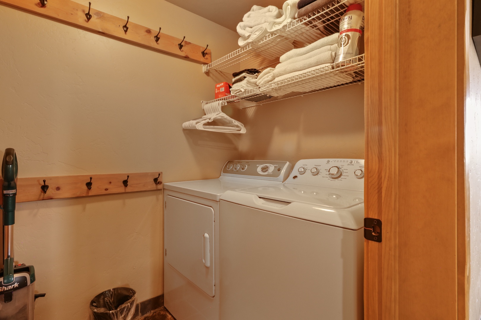 Your own washer and dryer make it easy to keep your vacation wardrobe fresh, with shelving above for neatly storing linens and essentials.