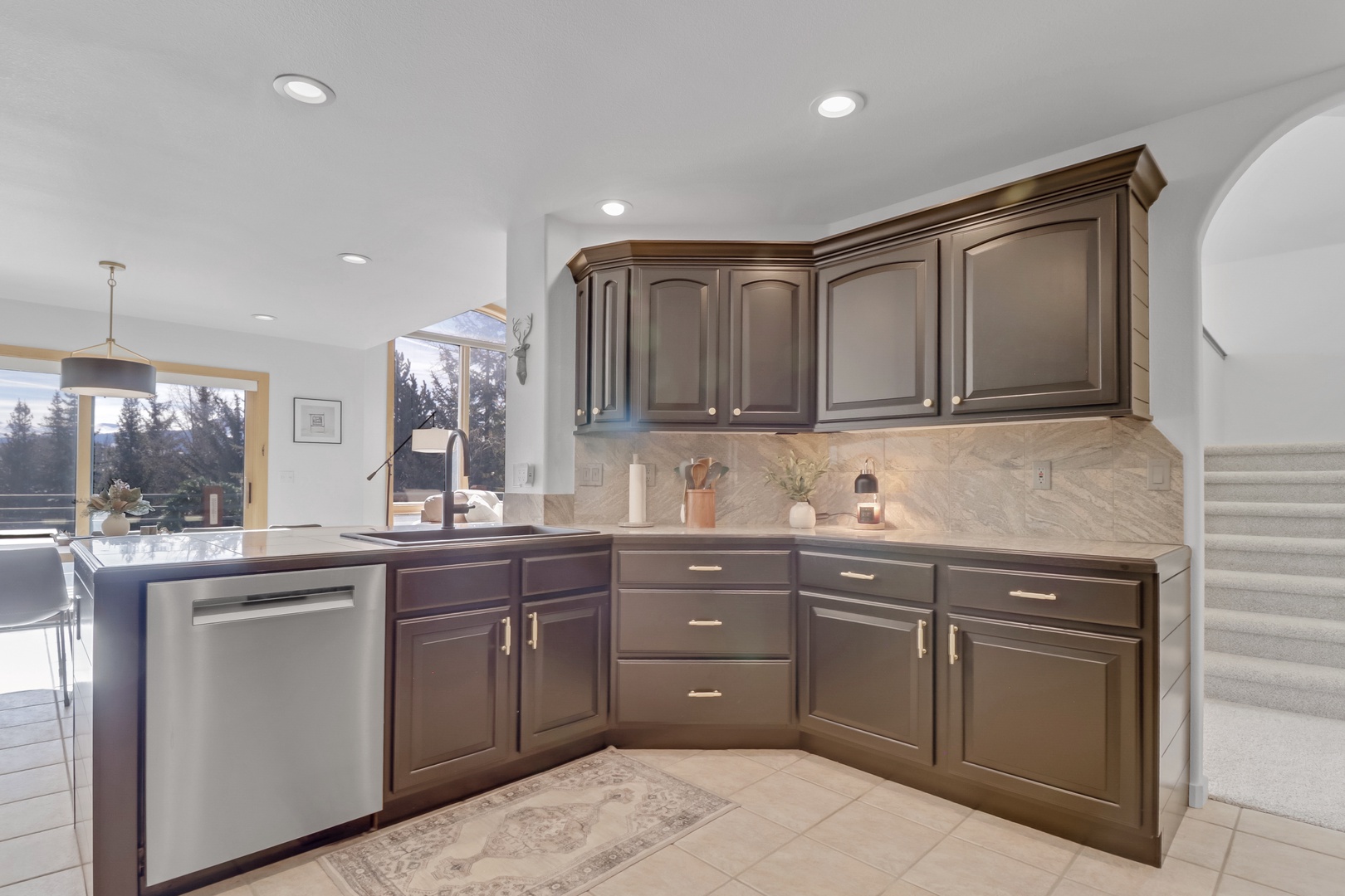 Your gourmet kitchen features sleek granite counters, modern appliances, and cabinetry perfect for preparing memorable meals during your stay.