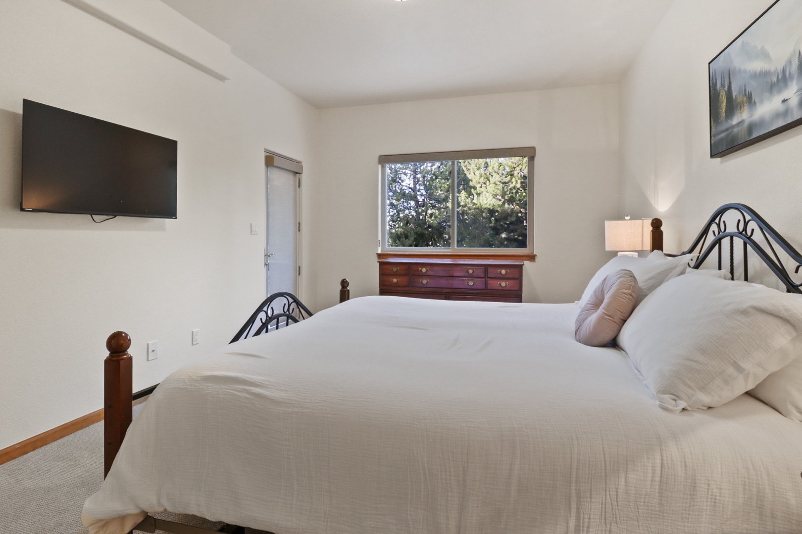 Sink into crisp linens and drift off while natural light streams through your window, with modern amenities at your fingertips.