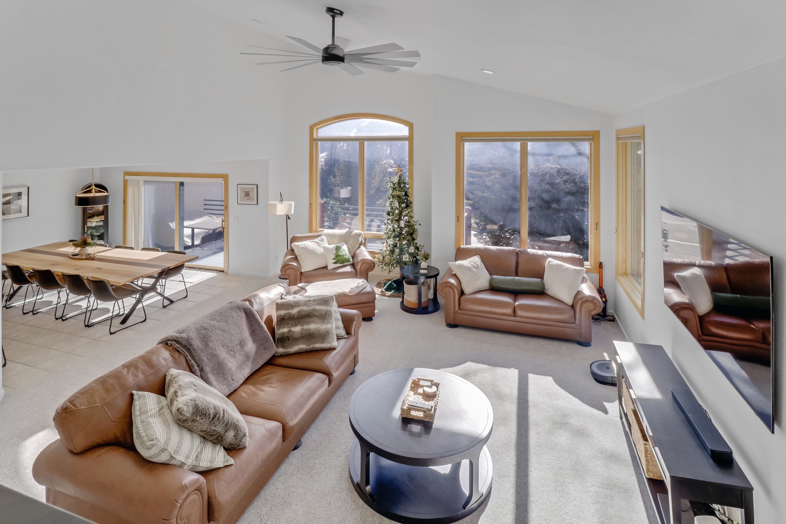 Relax in your spacious living room where plush leather seating and stunning mountain views create the perfect retreat for unwinding together.