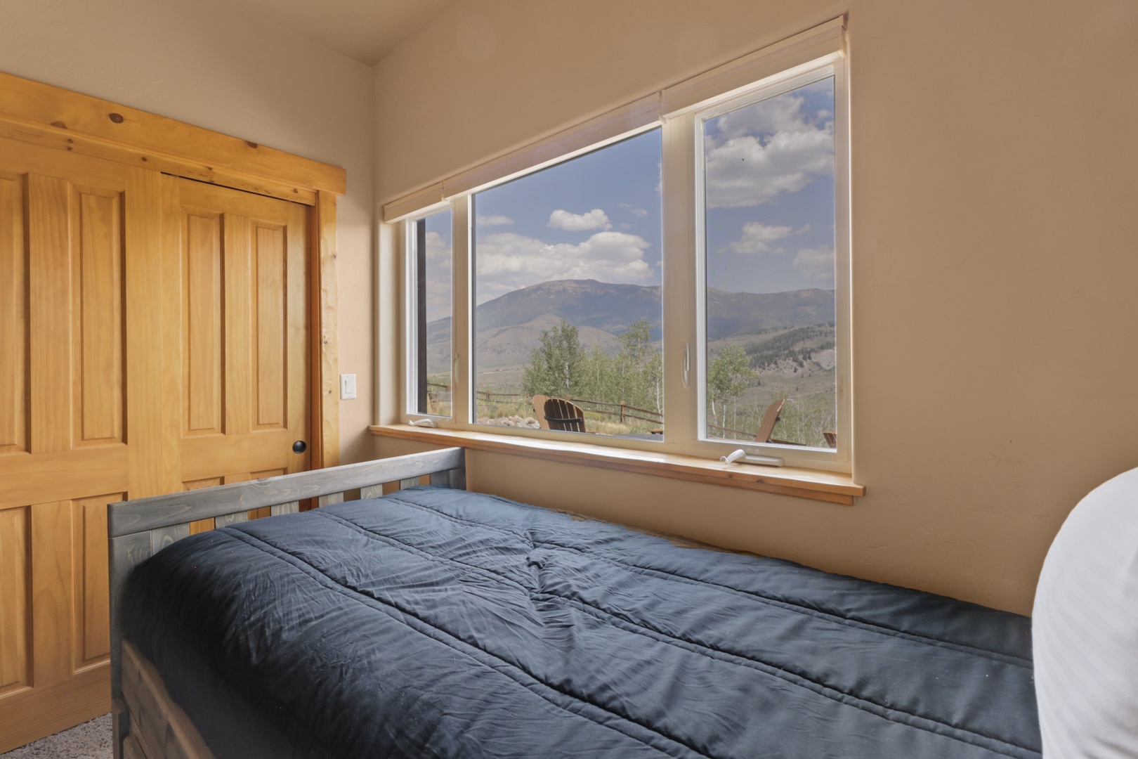 Wake up to stunning mountain views stretching across the horizon. Your cozy bedroom offers a front-row seat to nature's beauty, where every morning feels like a breath of fresh air.
