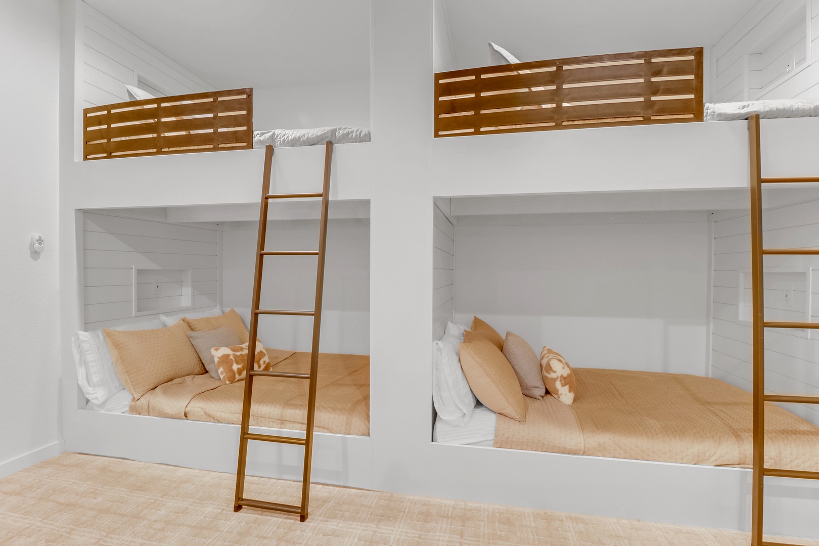 Step into your cozy bunk room where warm wood accents and soft linens create the perfect retreat for families or groups.