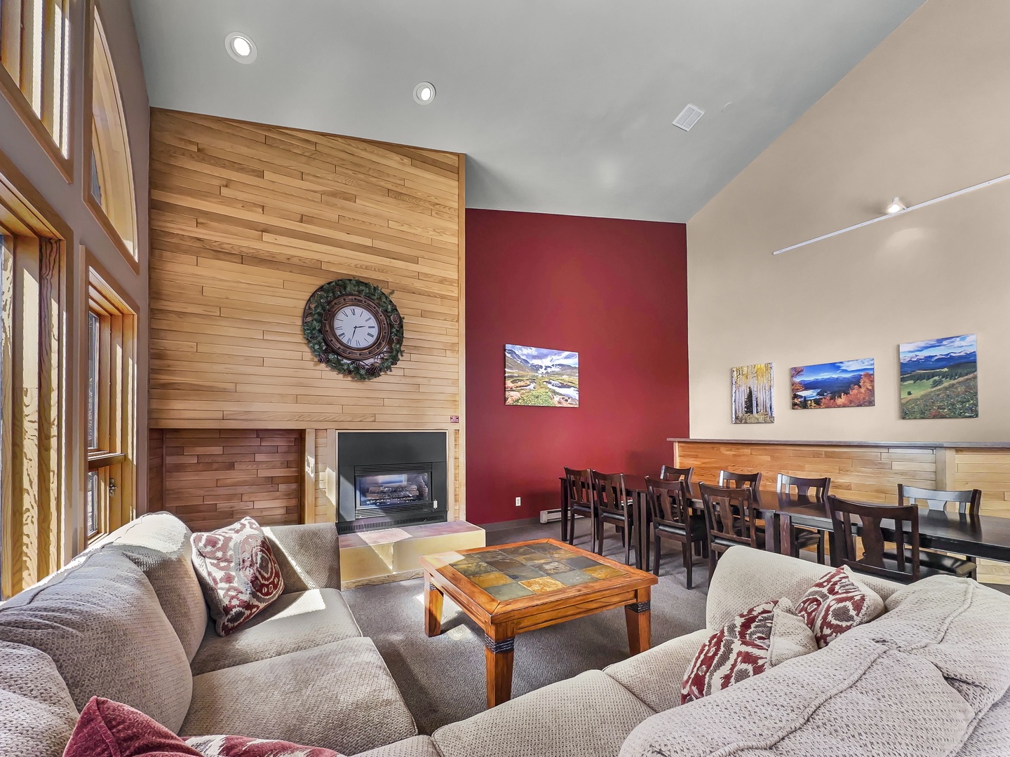 Sink into plush sofas by the fireplace while scenic mountain photos inspire your next adventure in this welcoming communal space.