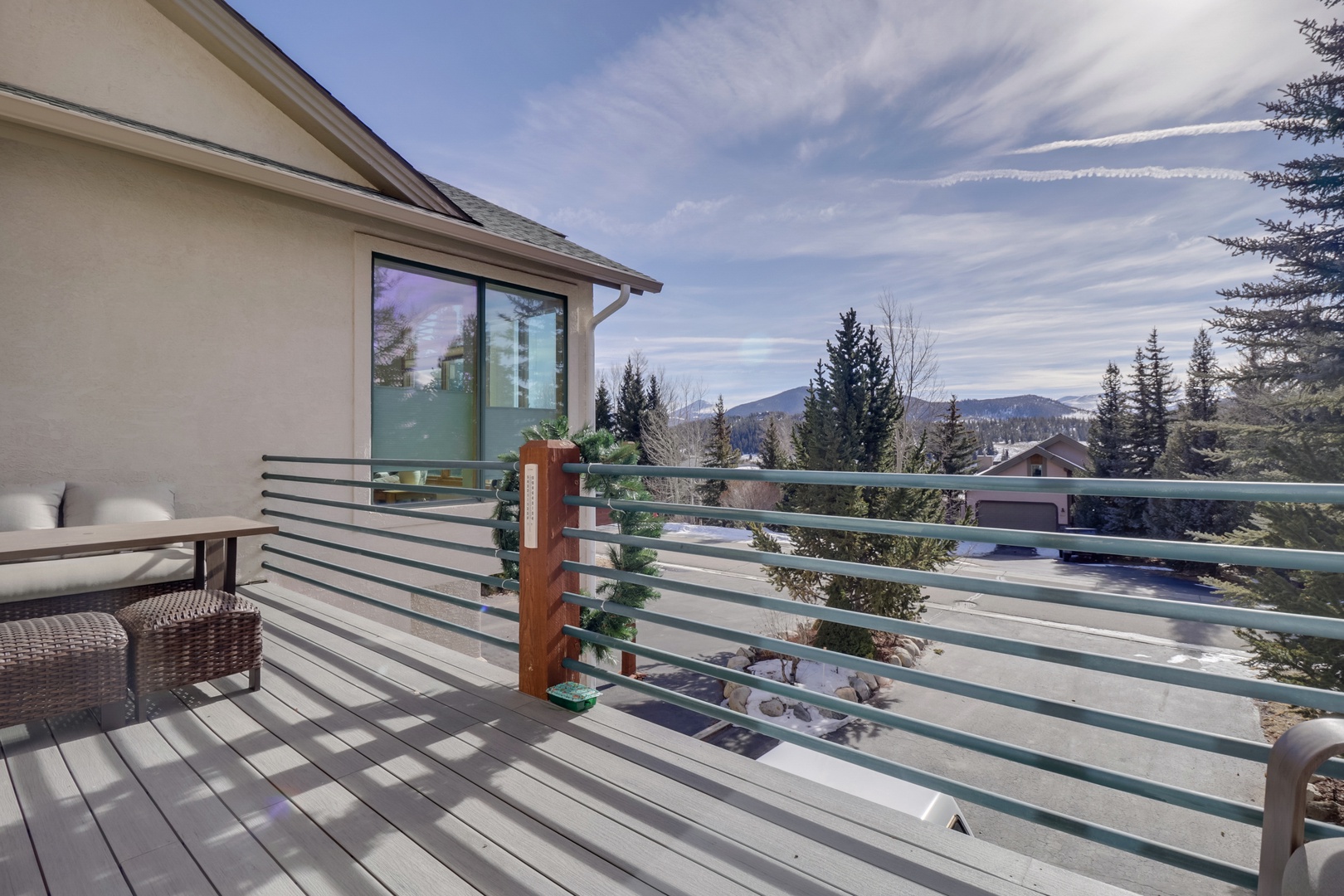 Relax on your private deck with stunning mountain views, perfect for morning coffee or evening unwinding amid peaceful surroundings.