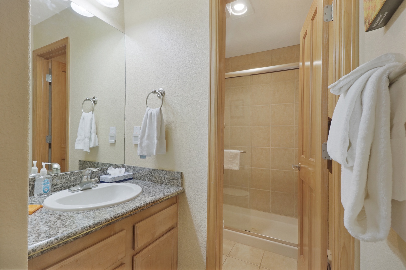 Your private bathroom features granite countertops, fresh towels, and a spacious walk-in shower—everything you need to refresh after a day of adventure.