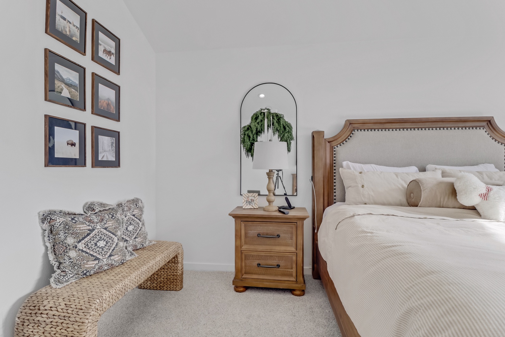 Drift into peaceful sleep in this beautifully styled bedroom, where warm wood tones and soft textures create your perfect retreat.