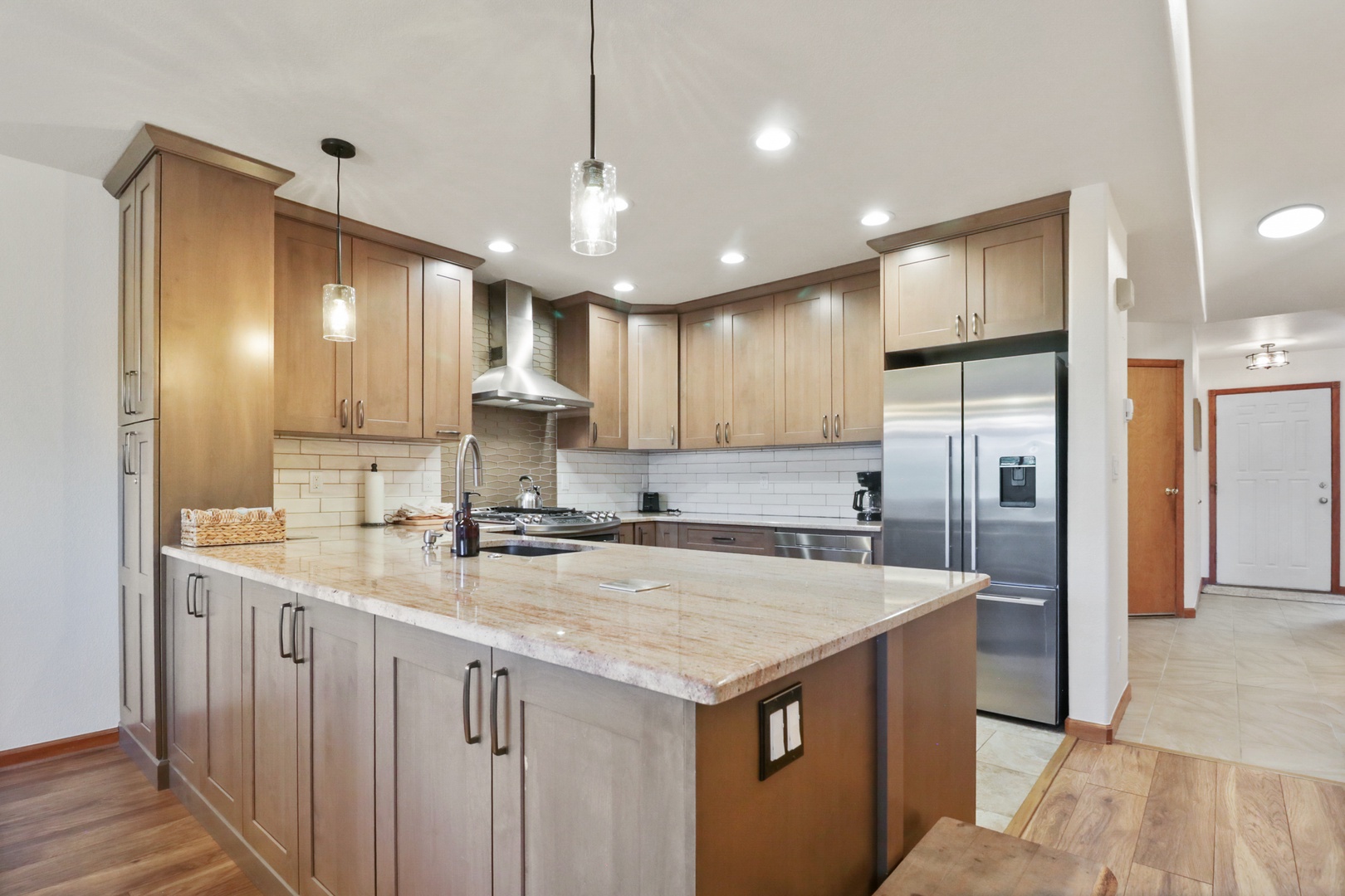 Your gourmet kitchen awaits with granite counters, stainless appliances, and warm wood cabinetry for memorable meal prep.