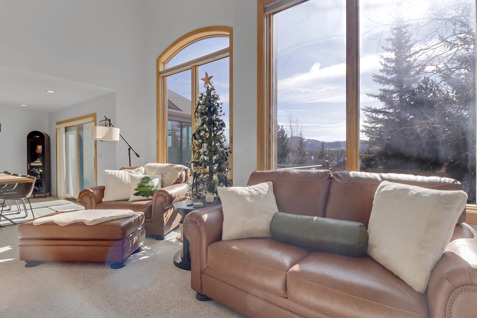 Sink into luxurious leather seating while mountain views fill the floor-to-ceiling windows, creating your perfect retreat.