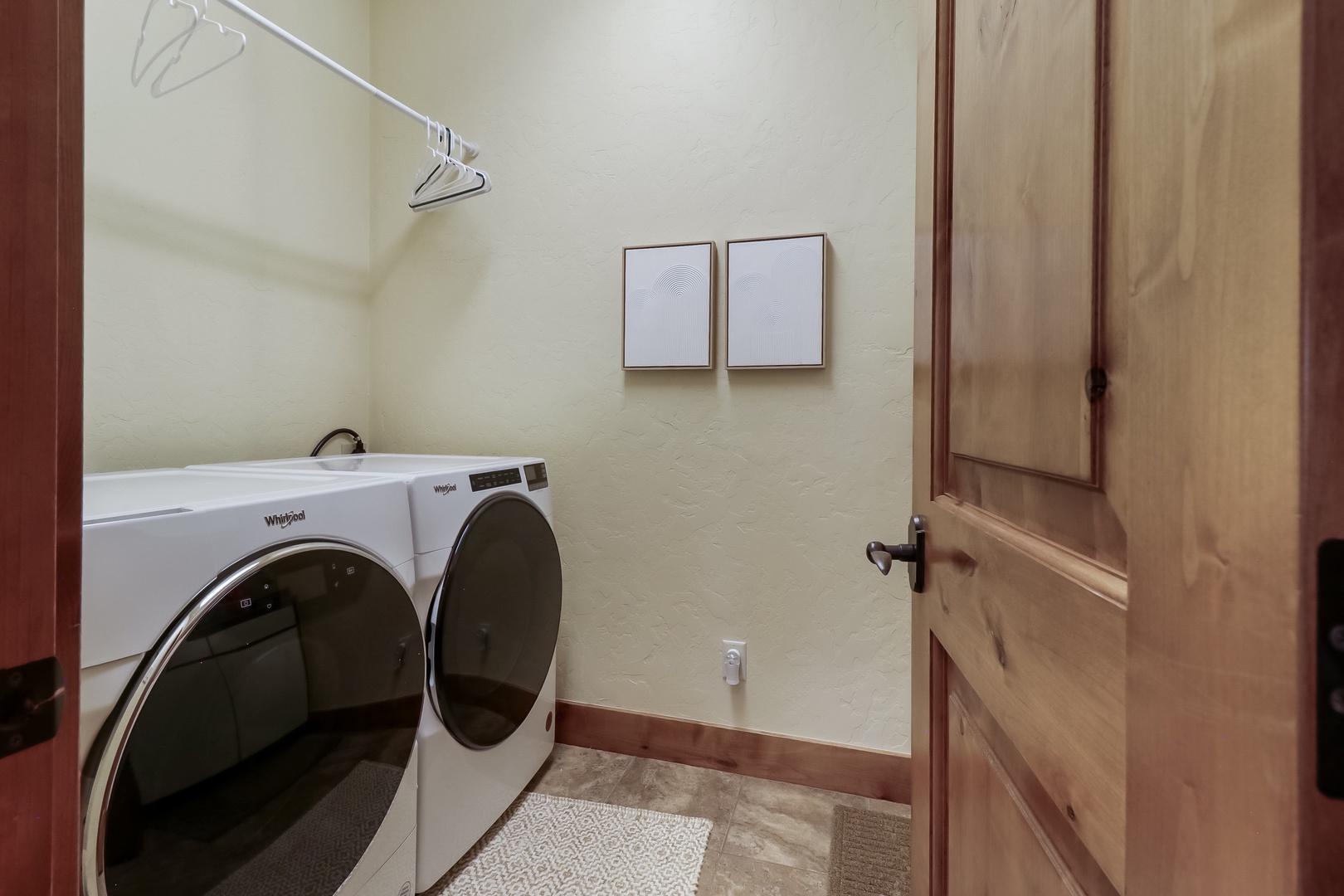 A dedicated laundry room with a full-size washer and dryer makes it easy to pack light and keep your wardrobe fresh throughout your stay.