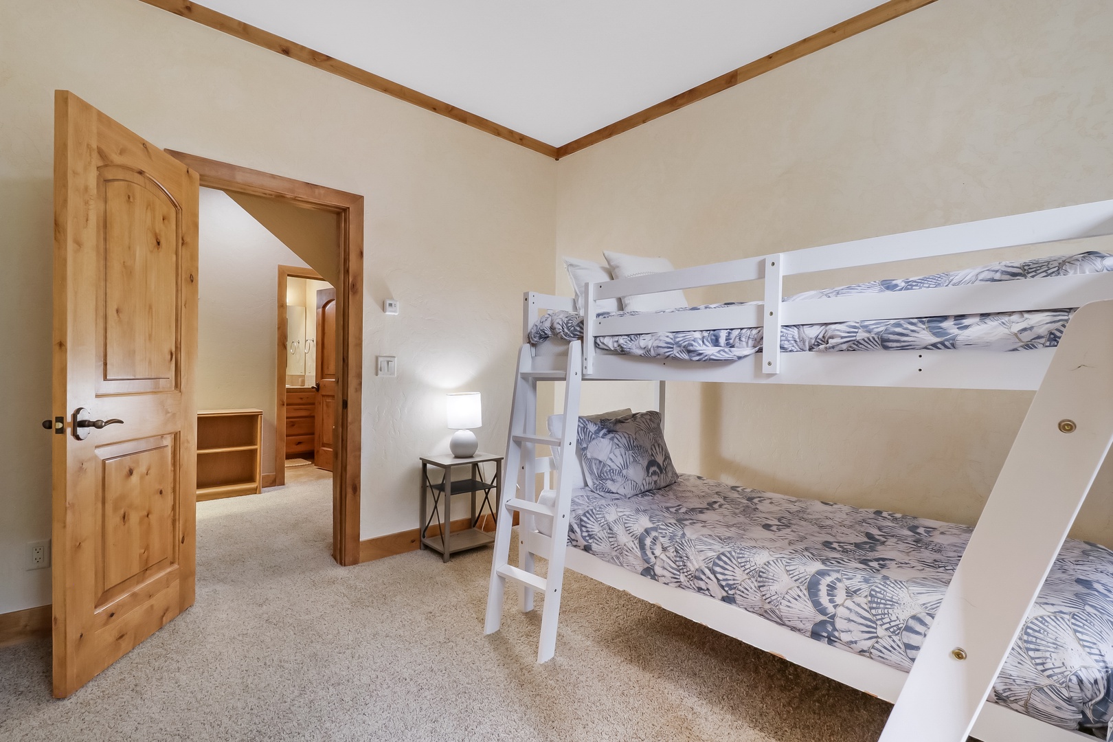 Your kids will love bunking together in this cozy room with soft bedding and a warm glow that makes bedtime easy. An open door welcomes you to explore the rest of your home away from home.
