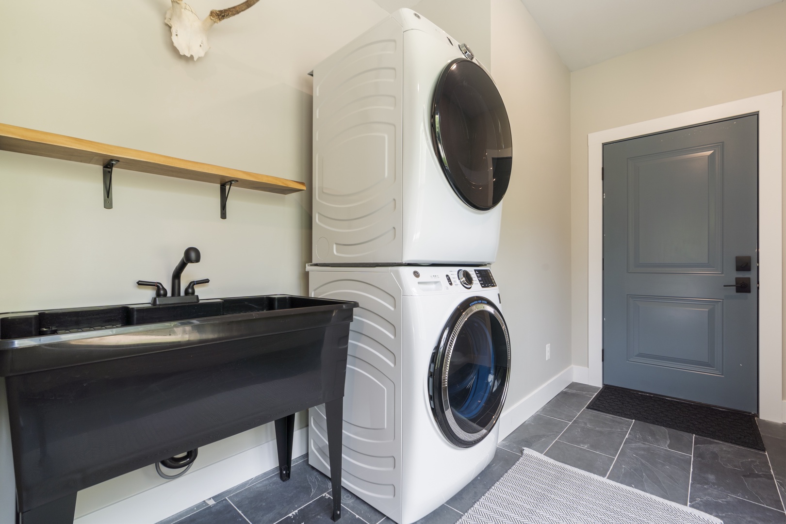 Your dedicated laundry space makes longer stays effortless, with a modern washer and dryer plus a utility sink for any extra needs.