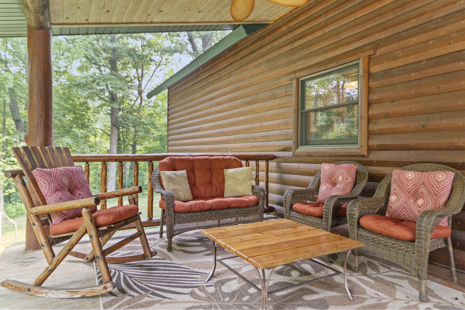 Settle into your private covered porch with plush seating, surrounded by lush forest views—the perfect spot to sip your morning coffee or unwind after a day exploring.