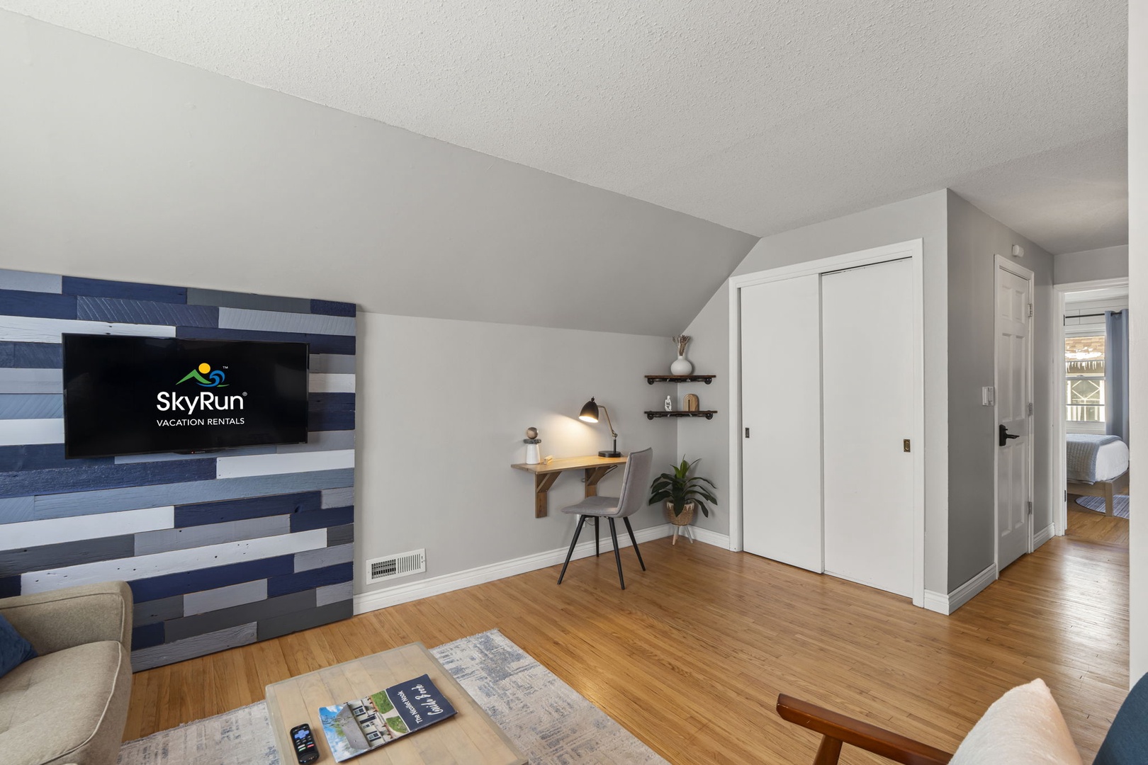 Relax in your bright living space with modern work nook, perfect for both productivity and unwinding after exploring.