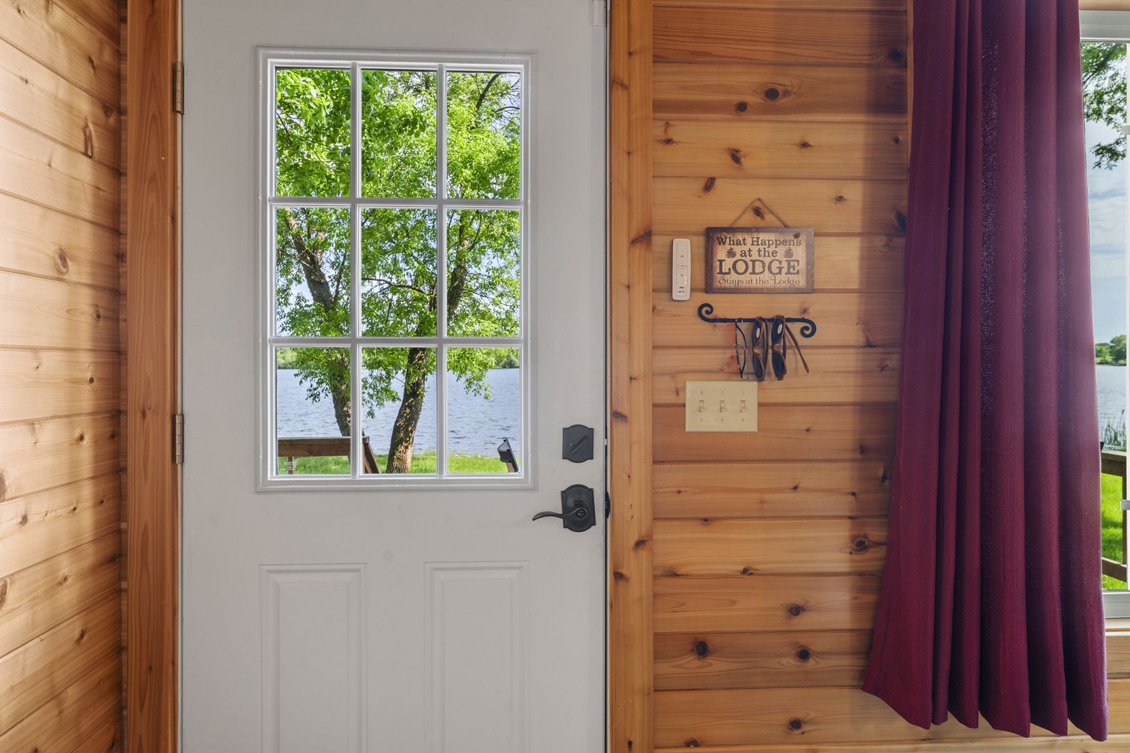 Step inside a warm, knotty-pine haven where lush lakeside views greet you at the door. Rustic charm and waterfront serenity blend perfectly in this cozy lodge escape.