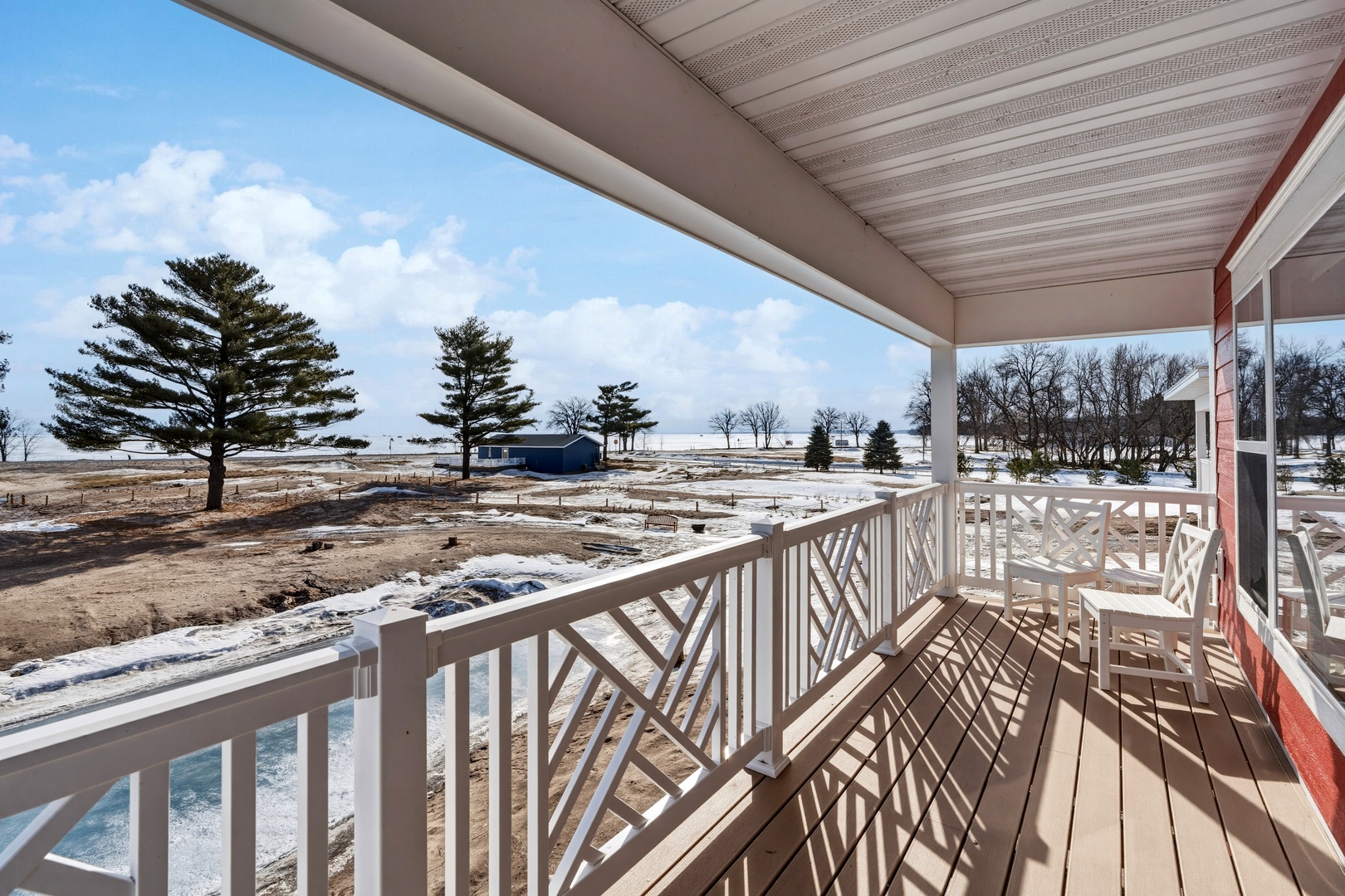 Upper level balcony with chippendale railing and lake views