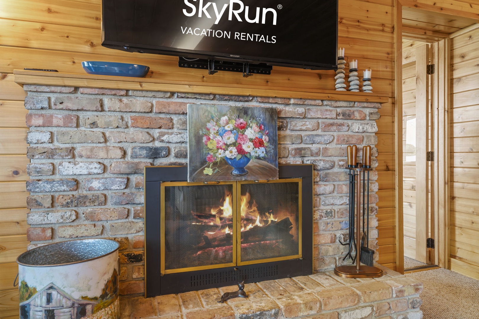 Warm up by the cozy brick fireplace, where crackling flames invite you to relax and unwind in comfort after your mountain adventures.