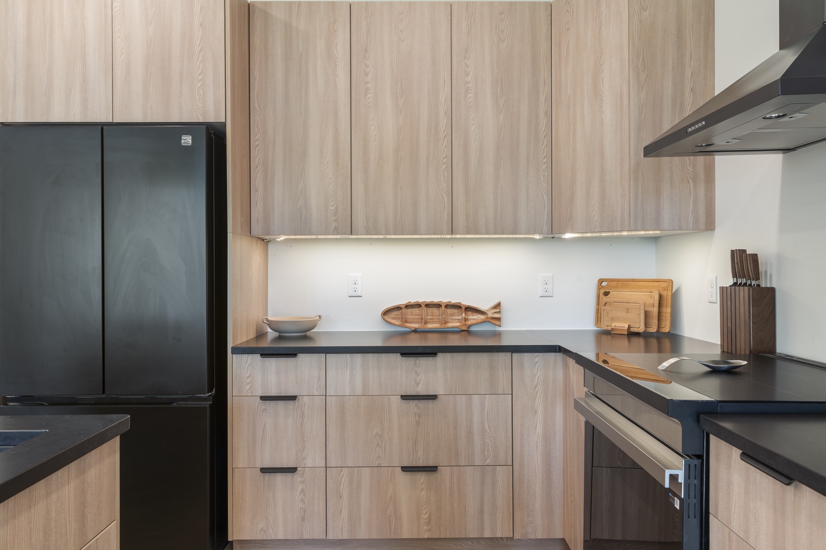 Your fully equipped kitchen invites effortless meal prep with sleek countertops, modern appliances, and ample storage—ready for your morning coffee or a homemade feast.