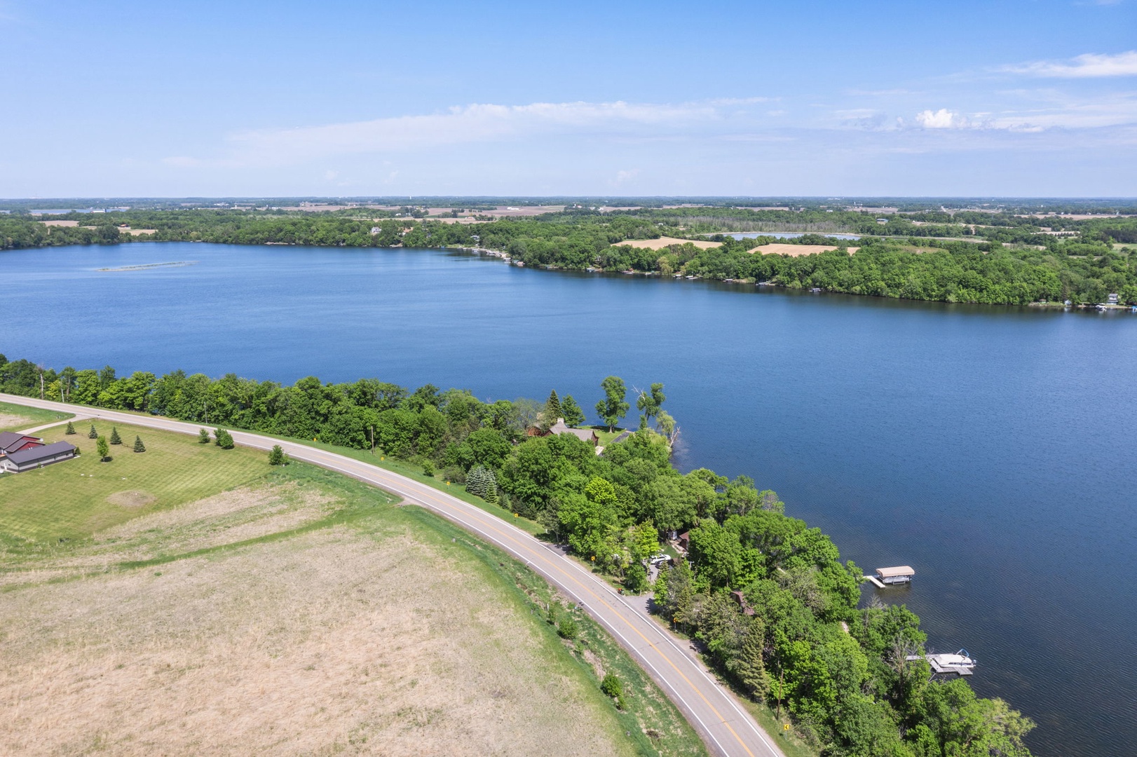 Scenic waterfront location nestled along a tranquil lake, surrounded by lush greenery and peaceful countryside, offering a serene setting for your getaway.