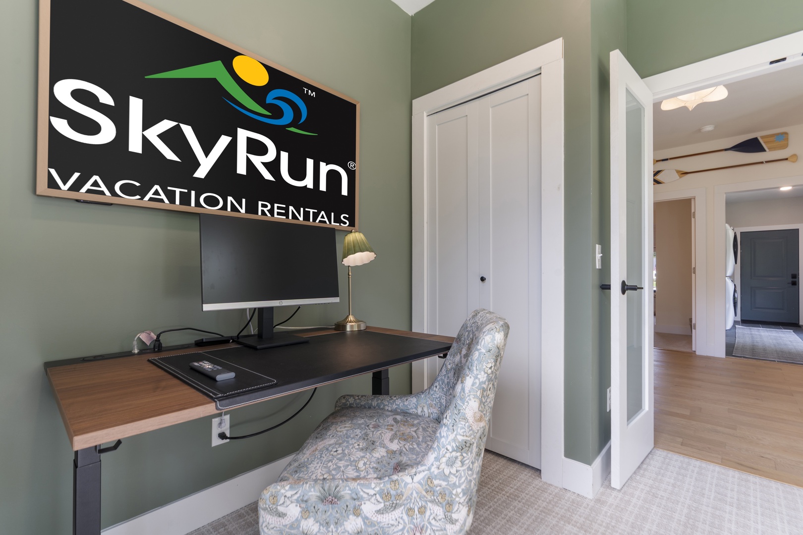 Your own flexible workspace blends function and style, with an adjustable desk and peaceful sage-green surroundings that help you unwind and stay productive whenever you need.