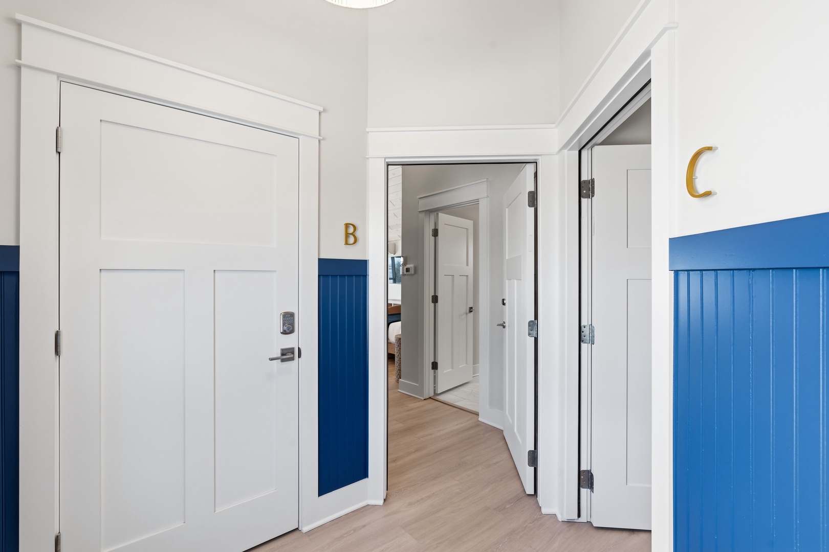 Private unit entrance in charming lakeside hallway