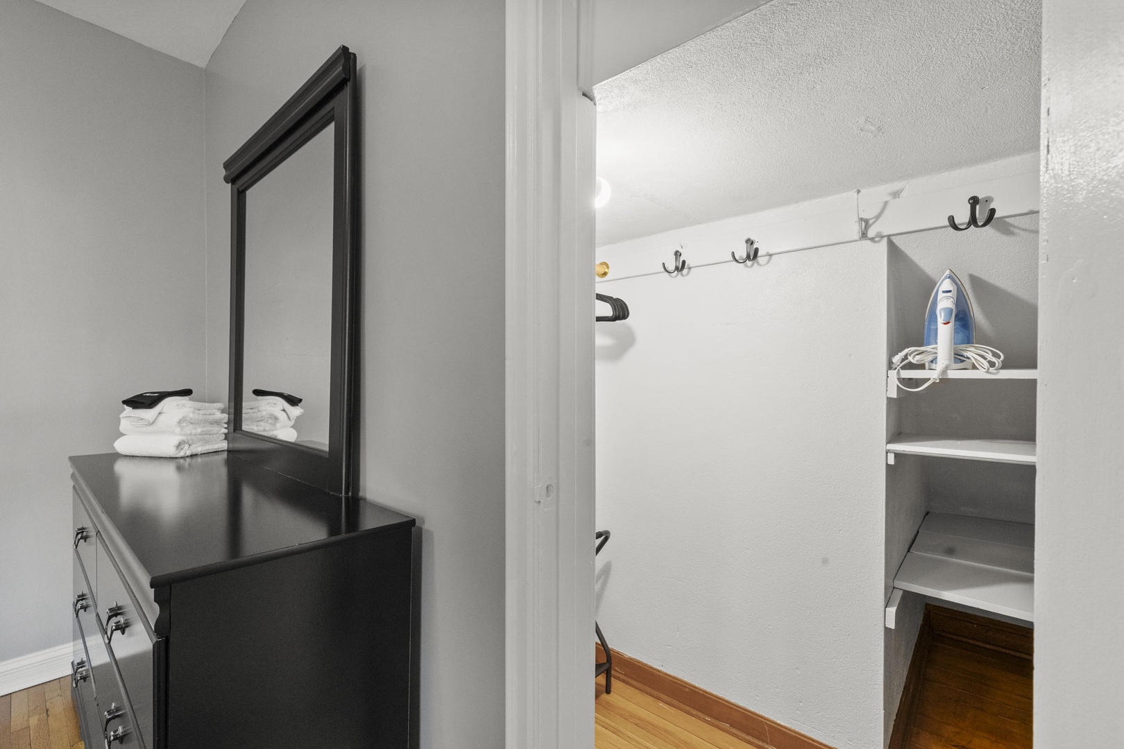 Your bedroom includes thoughtful touches—fresh towels, an iron for crisp mornings, and organized storage for your belongings.