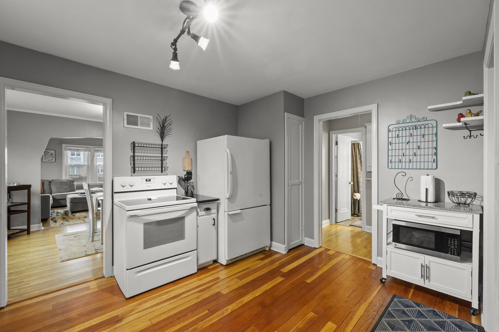 A fully equipped kitchen features a gas range, full-size refrigerator, and microwave, giving you everything you need to whip up meals during your stay.