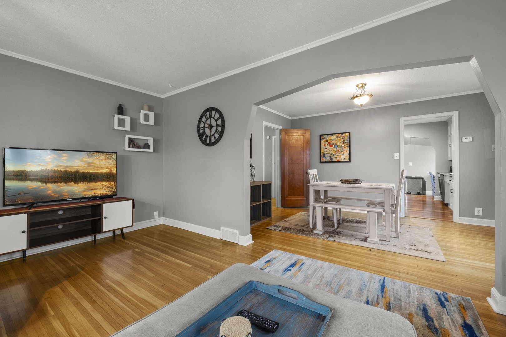 Relax in your spacious living and dining area, where warm hardwood floors and soft gray walls create a calm retreat. Unwind with your favorite shows or share meals together in this inviting, open layout.