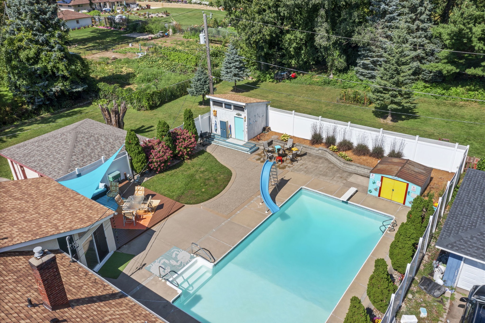 Aerial view of spacious backyard area with plenty of seating. Pool is not available for guest use per Minnesota state law.