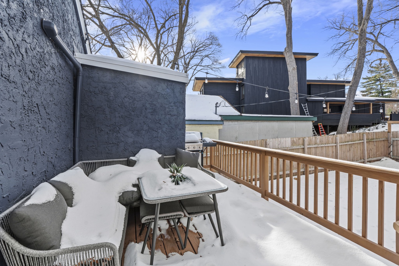 Patio with modern outdoor furniture during winter season.