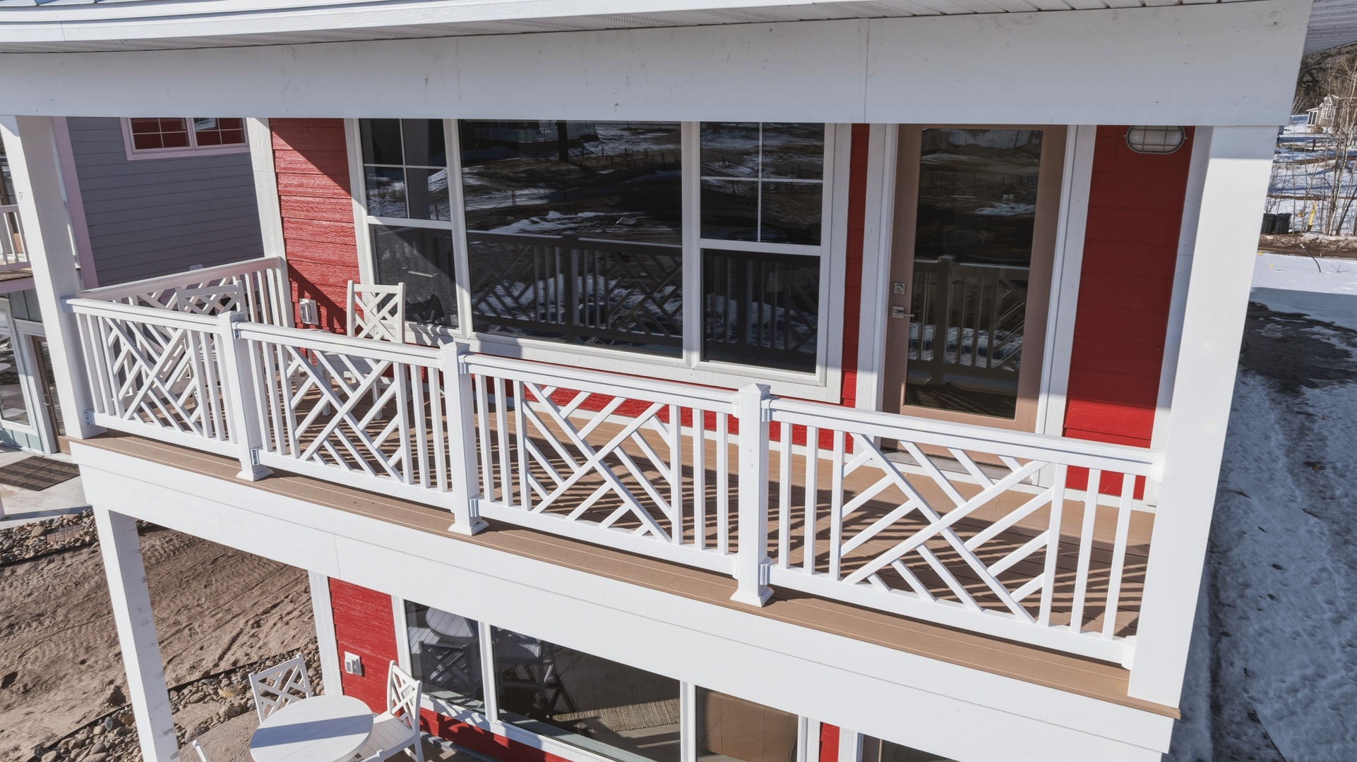 Upper balcony with chippendale railing and panoramic windows