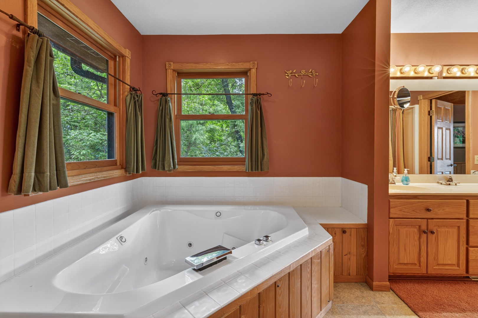 Sink into the spacious jetted tub and let your muscles relax as natural light filters through the windows, creating your own private spa retreat.
