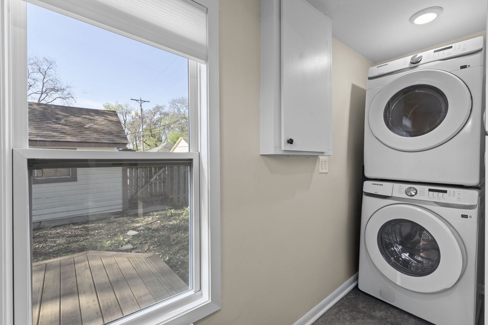 In-unit Samsung stacked washer and dryer — do laundry any time during your stay, with a backyard view to enjoy while you wait.