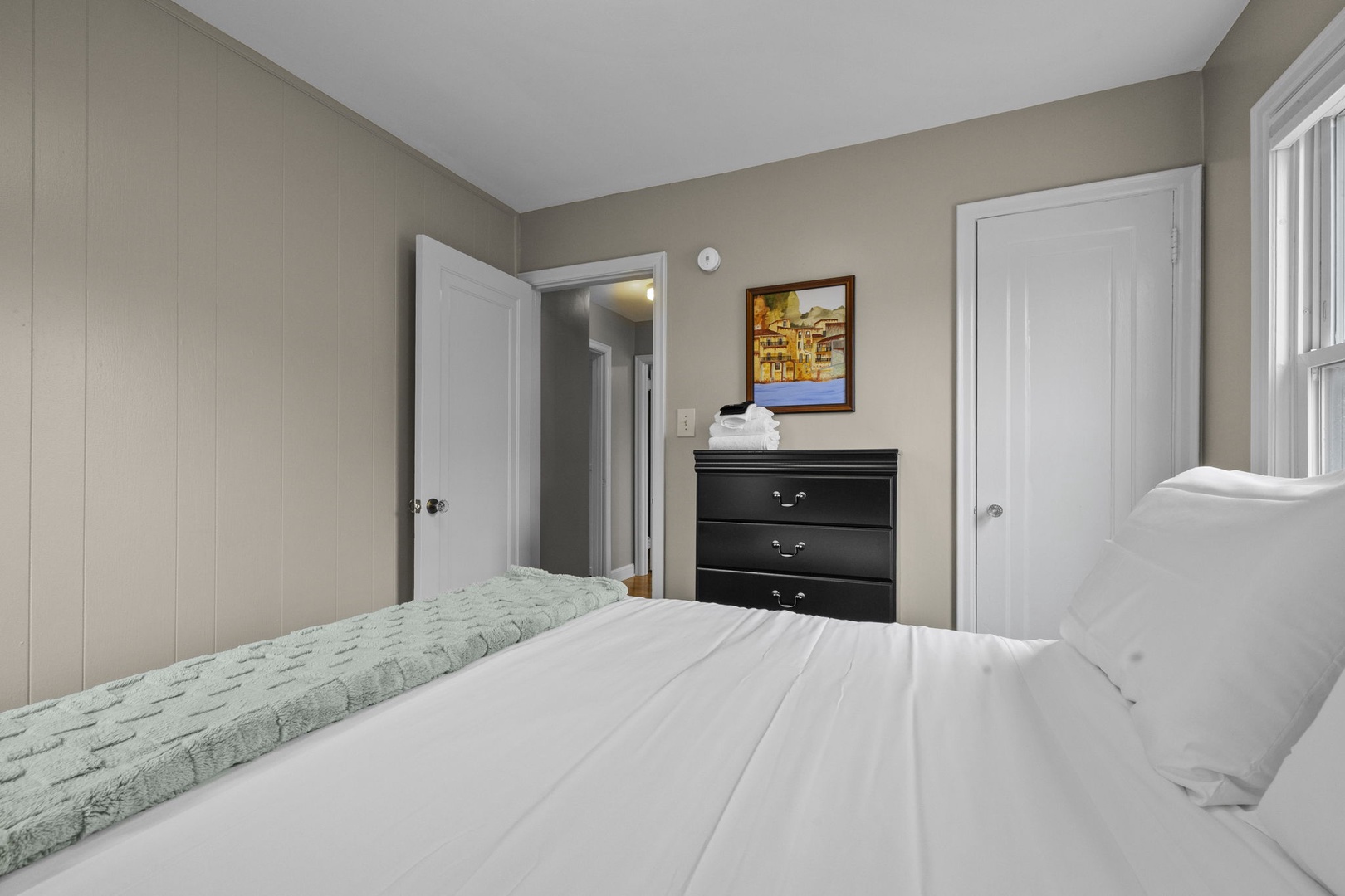 Sink into fresh linens and unwind in your cozy bedroom, complete with ample closet space and thoughtful touches of home.