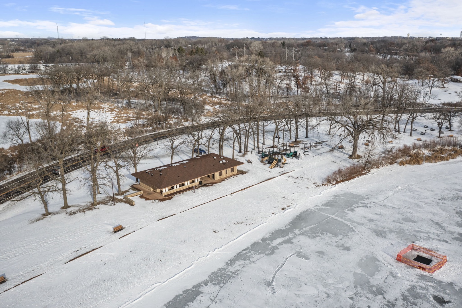Lakeside park building and playground just steps from the water