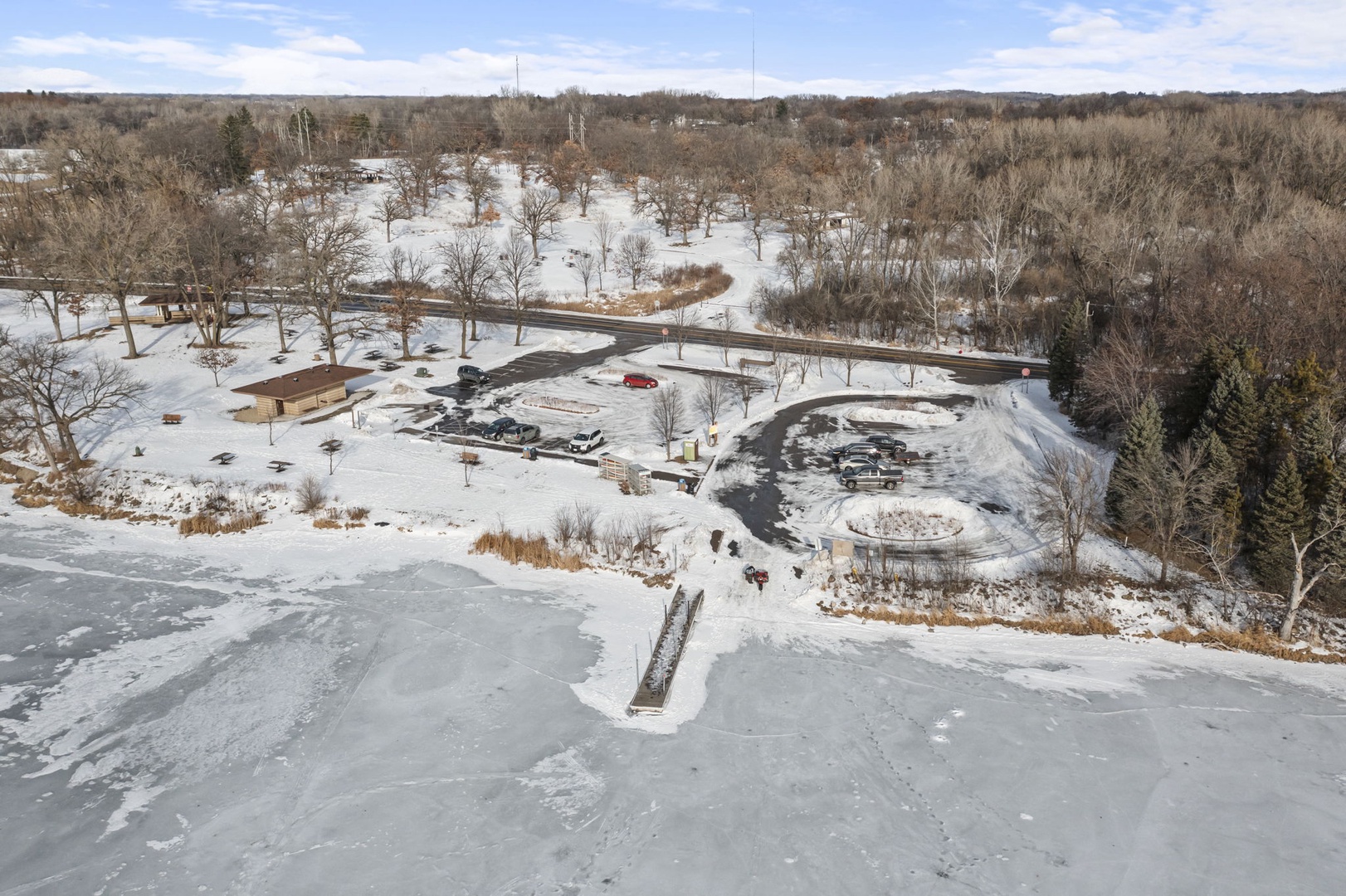 Winter aerial highlighting lake access points and surrounding green space
