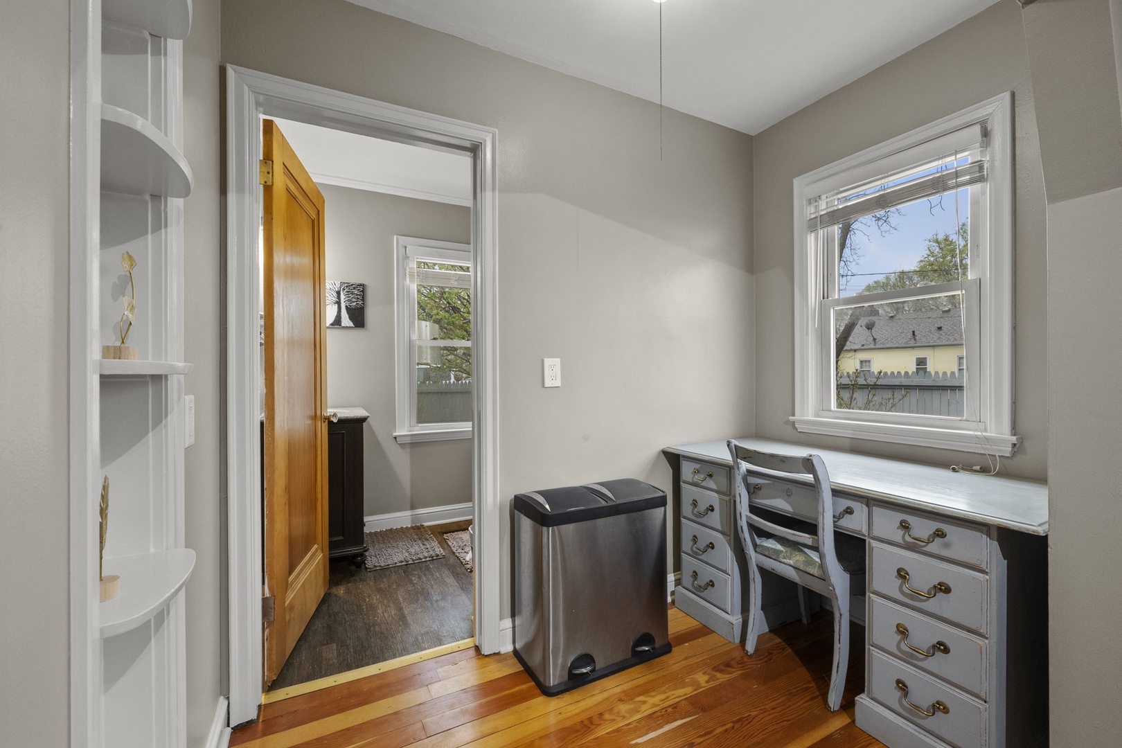 A peaceful corner workspace with natural light streaming in, perfect for checking emails or planning your daily adventures.