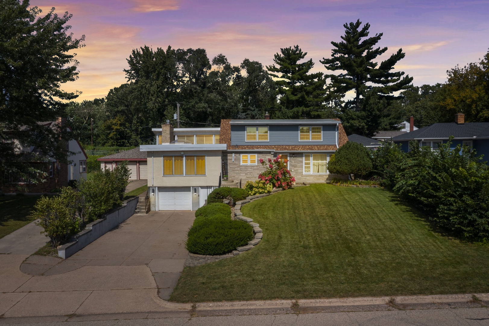 Modern property nestled in a peaceful residential neighborhood with manicured landscaping and mature trees creating a serene setting.