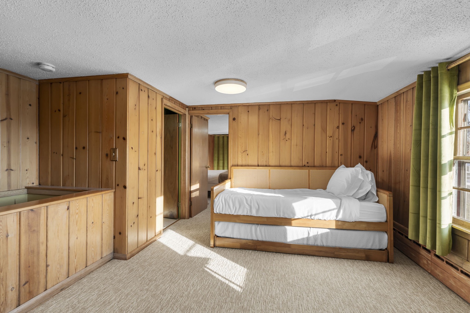 The second floor sleeping loft features a trundle bed which can be converted into a king size bed.