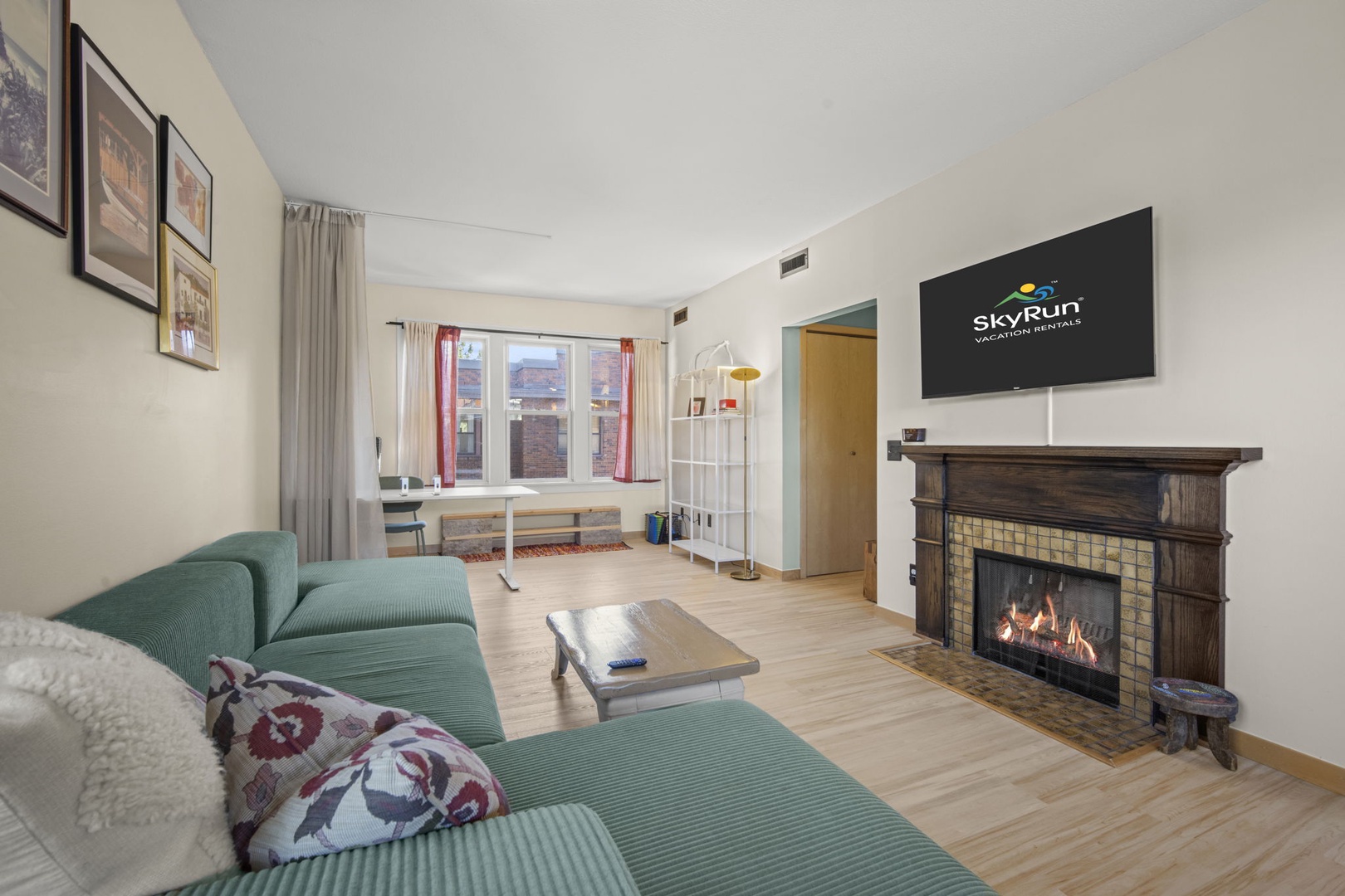 Unwind in your bright living space, where a cozy fireplace and comfortable seating invite you to relax after a day of exploring. Natural light fills the room, creating a warm and welcoming atmosphere.