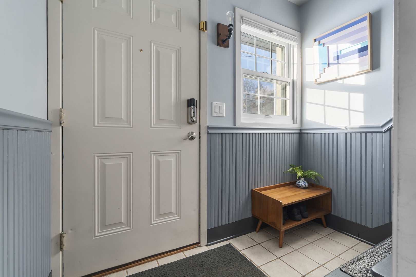 08 — Private Entry Foyer with Beadboard Wainscoting Smart Lock and Shoe Bench