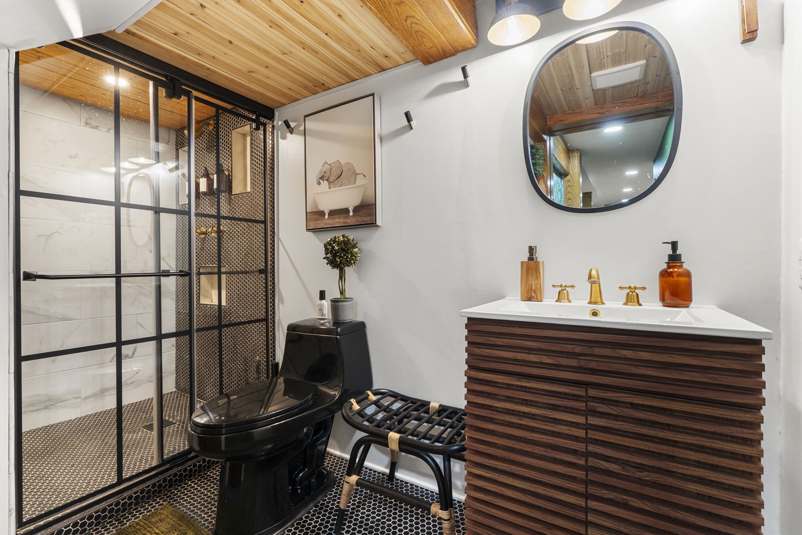 Step into your luxurious spa-like bathroom with rich wood details, elegant finishes, and a stunning glass-enclosed shower that makes every morning feel like a retreat.