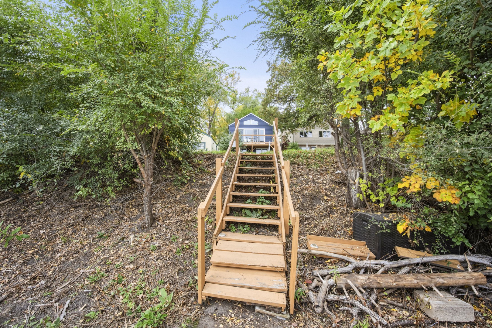 Stairs lead down to private dock area.