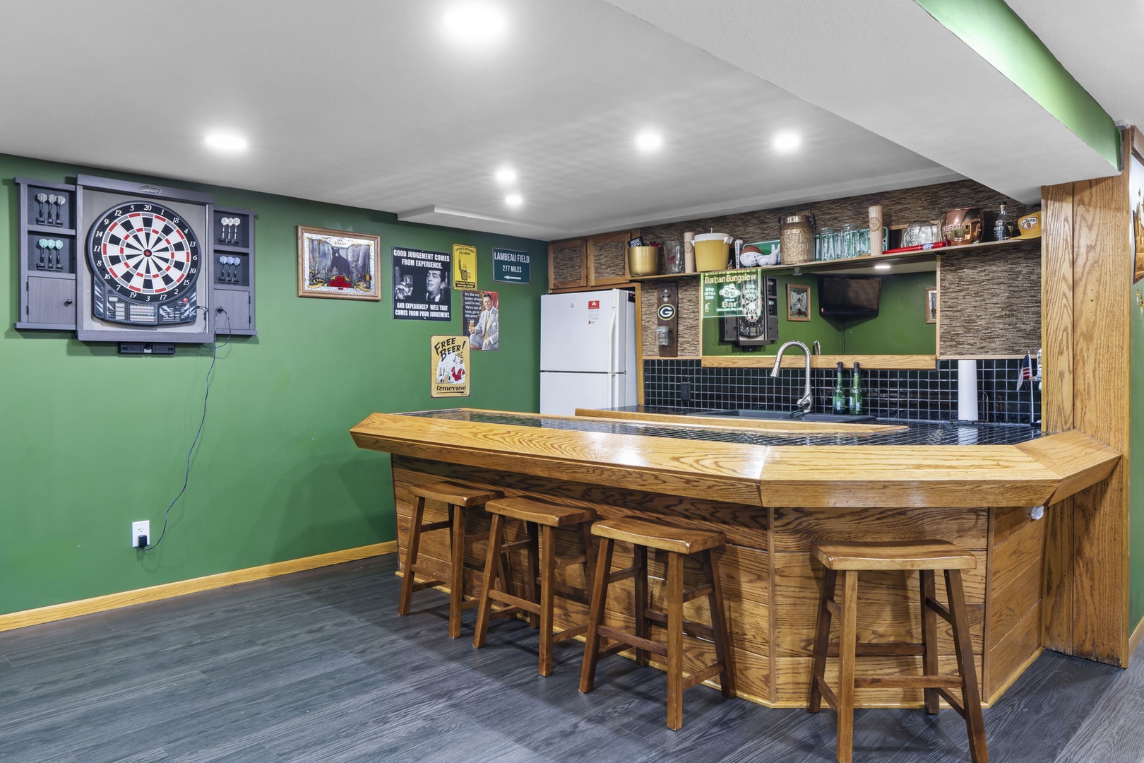 Unwind in your own entertainment haven with a full bar, dartboard, and cozy seating—perfect for memorable evenings with friends.